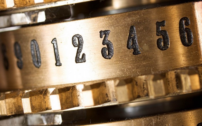 Close up of metal gears with numbers