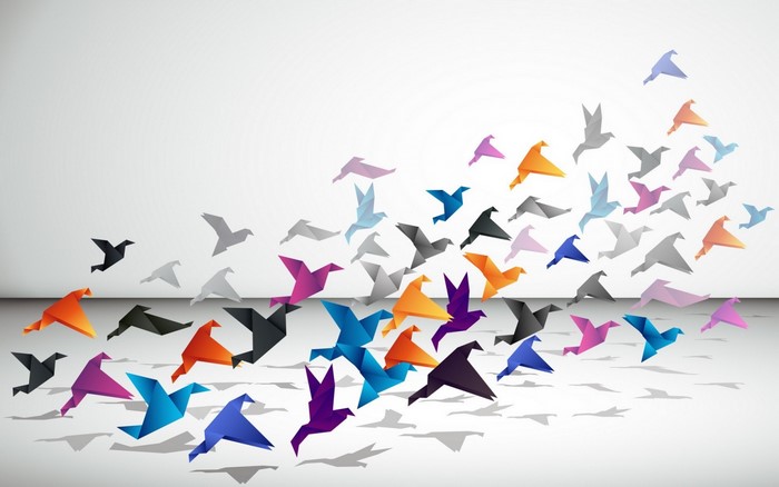 Origami birds flying in a flock