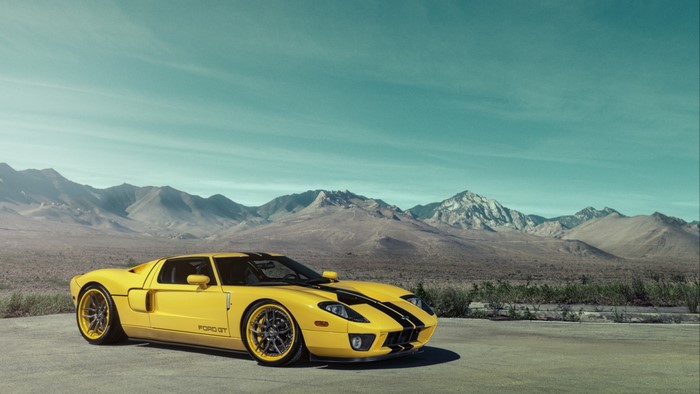 Yellow Ford GT with Black Stripes in Desert Landscape