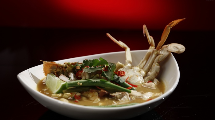 Crab soup with lime and herbs