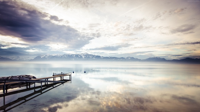 4K lake with mountains and pier
