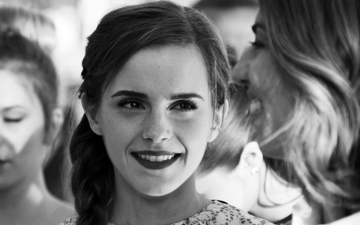 Emma Watson Smiling in Black and White Portrait