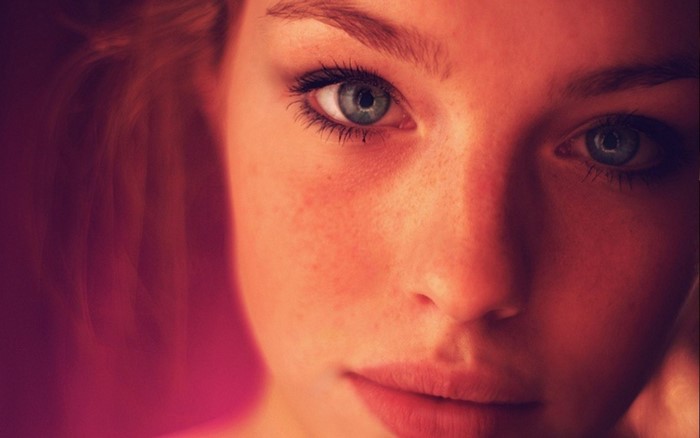 Close-up portrait of a woman with blue eyes