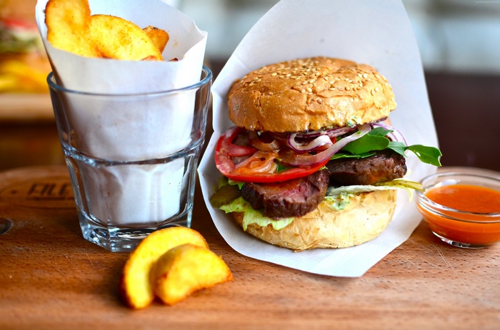 Burger with fries and dipping sauce