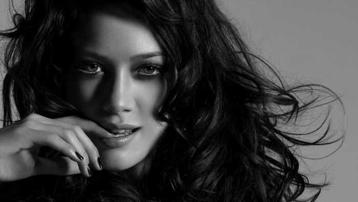 Hilary Duff portrait with hand on face