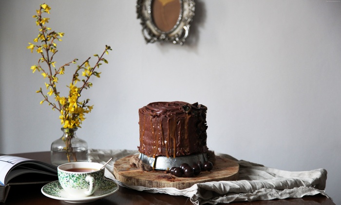 Chocolate cake with cherries and tea