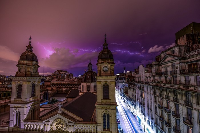 Lightning storm over Buenos Aires cityscape with church