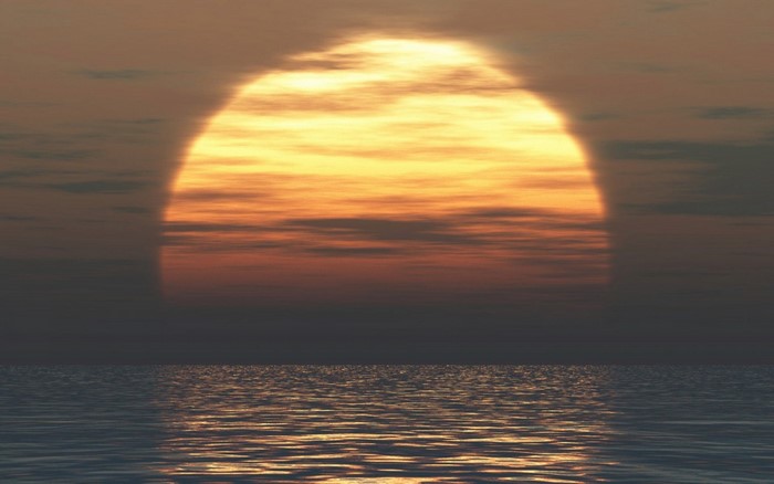 Sunset over the ocean with clouds