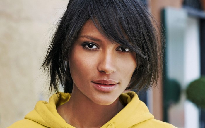 Emanuela de Paula portrait in yellow hoodie