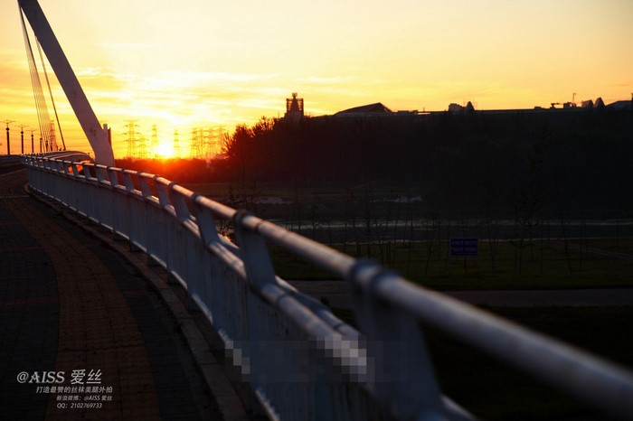 Bridge at sunset with power lines