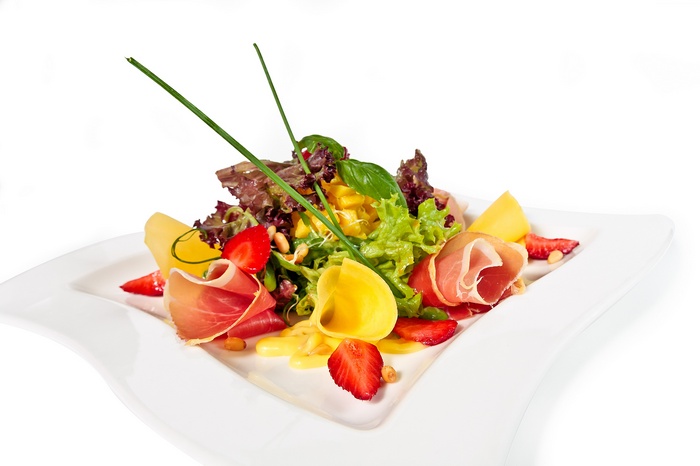 Salad with prosciutto, strawberries, and mango