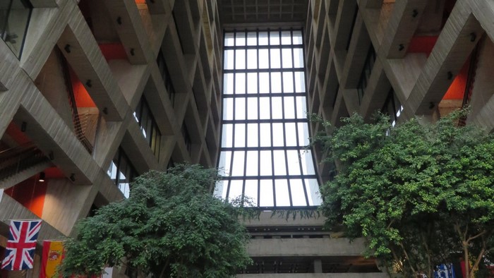 Interior of a Brutalist building with a large window