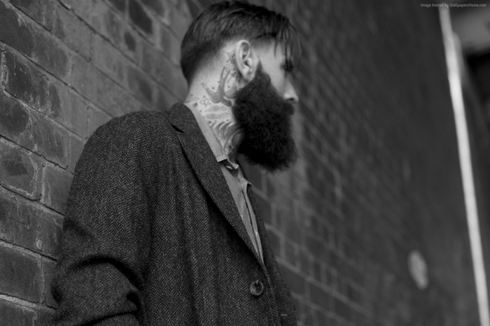 Man with beard and tattoos