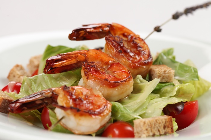 Shrimp salad with lettuce, croutons, and tomatoes