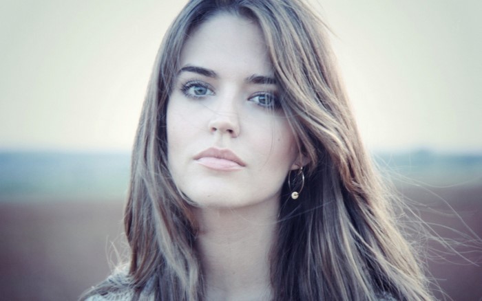 Portrait of Woman with Blue Eyes and Long Brown Hair