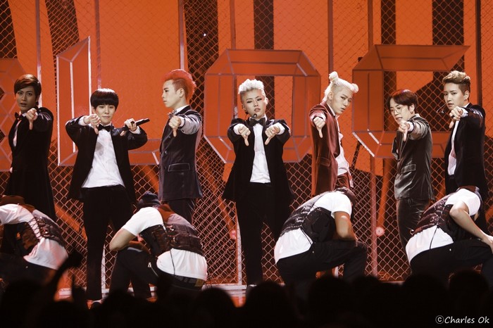 Block B members performing on stage