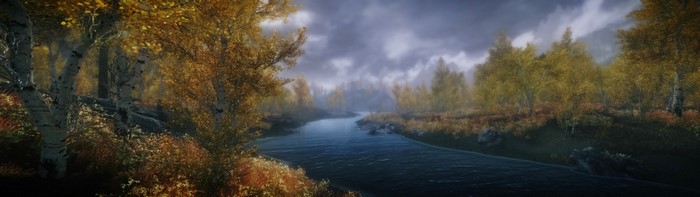 Autumn forest with river and mist