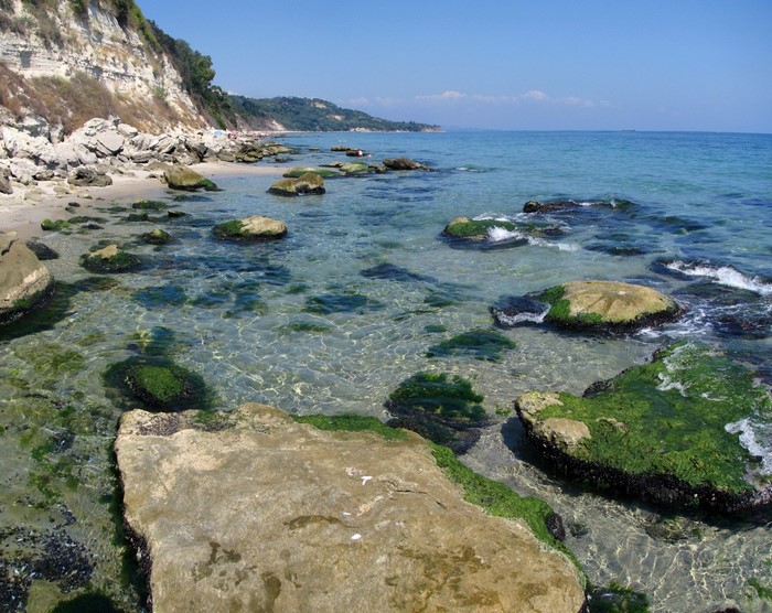 Rocky beach with clear water and cliffs
