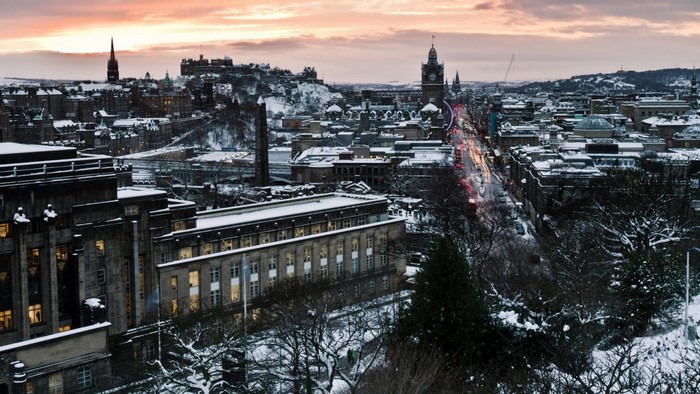Edinburgh cityscape with snow at dusk
