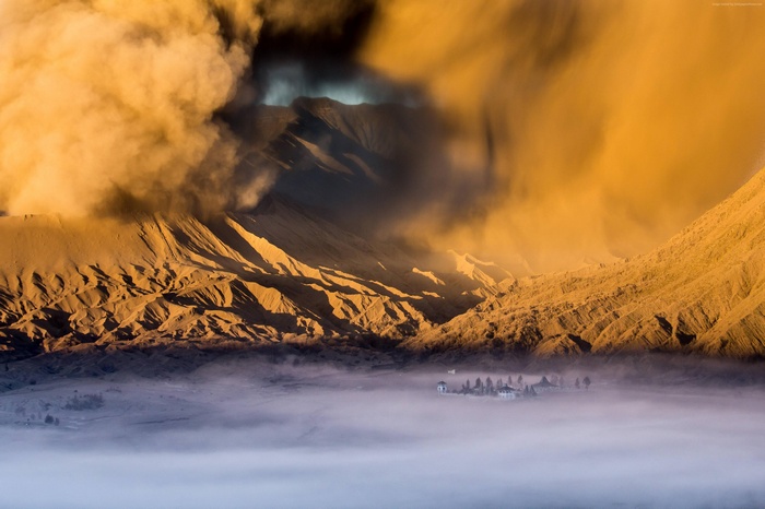 Mountains with clouds and a village in a valley
