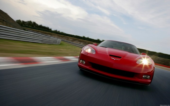 Red Chevrolet Corvette C6 ZR1 on a race track