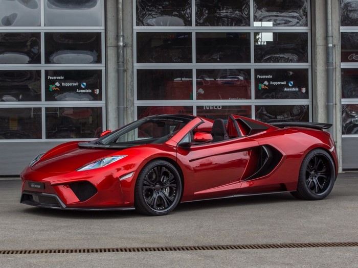 Red McLaren MP4-12C Spider parked in front of a fire station
