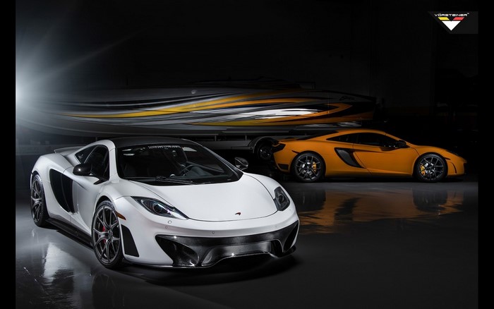 White and orange McLaren MP4-12C sports cars