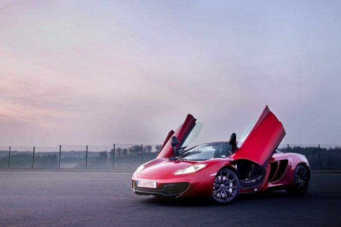 Red McLaren MP4-12C with doors open