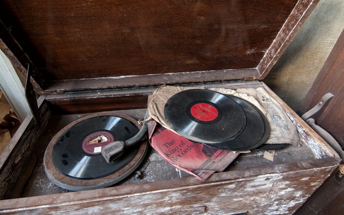 Vintage phonograph with records in a wooden cabinet