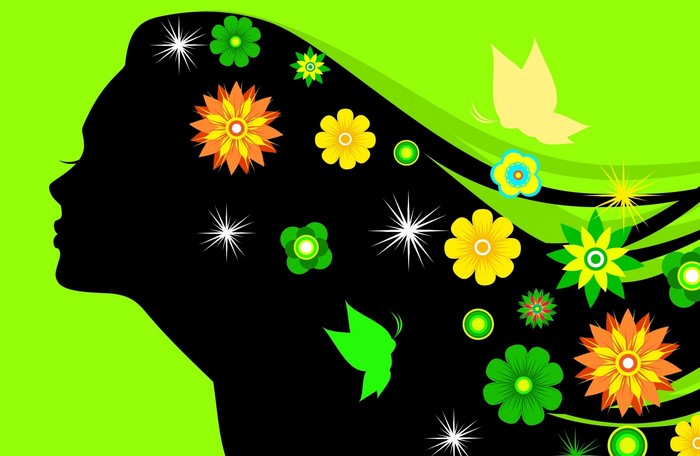 Silhouette of a woman's head with flowers and butterflies