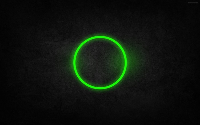 Green circle on a dark textured background