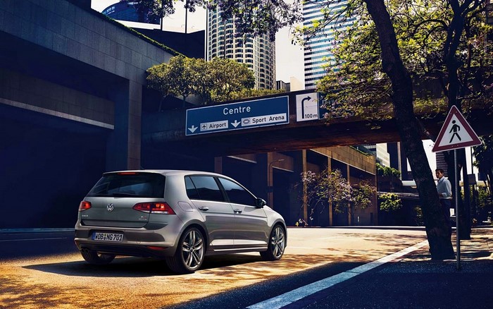 Volkswagen Golf VII driving in a city