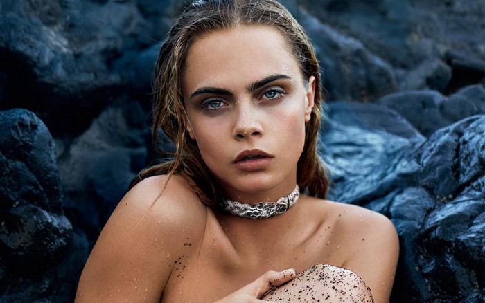 Cara Delevingne wearing a necklace with blue rocks