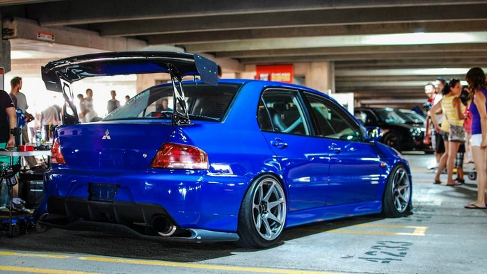 Blue Mitsubishi Lancer Evolution with large spoiler