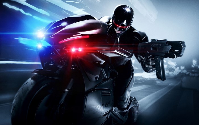 RoboCop on a motorcycle with a gun