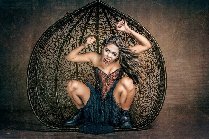 Vampire woman in a cage
