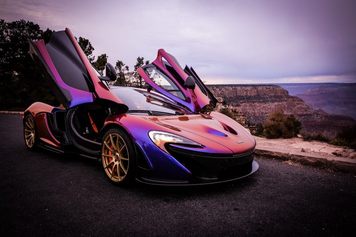 McLaren P1 supercar with butterfly doors open at Grand Canyon