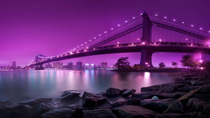Manhattan Bridge at night with purple sky
