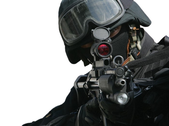 Soldier aiming a rifle with red dot sight