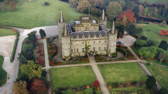 Aerial view of a castle estate in Scotland during fall
