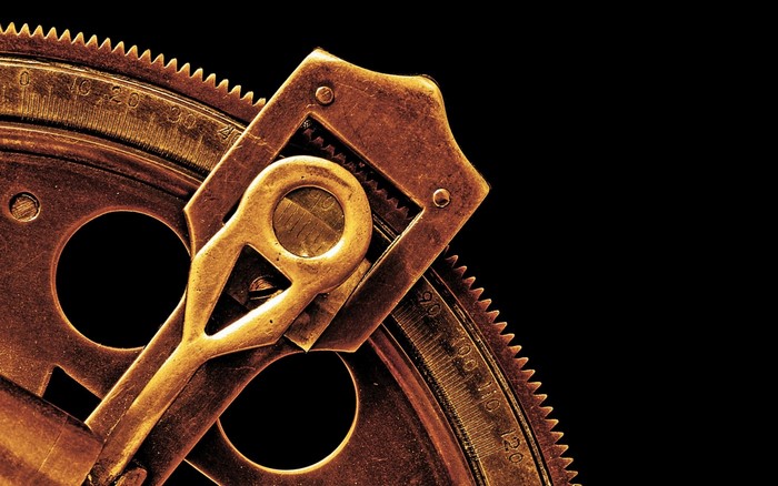 Close-up of a vintage brass astrolabe mechanism