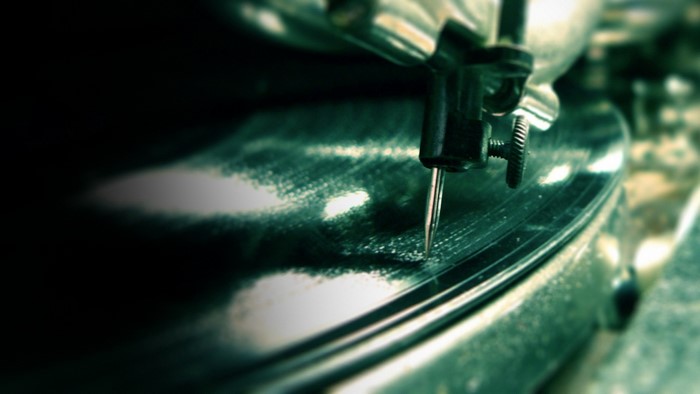 Close-up of a record player needle on a vinyl record