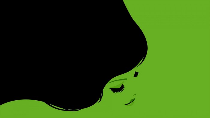 Minimalist illustration of a woman with black hair and green skin