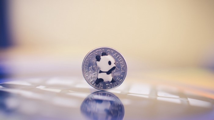 Panda figurine on a United States dime