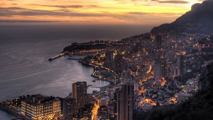 Cityscape of Monaco at dusk with the Mediterranean Sea