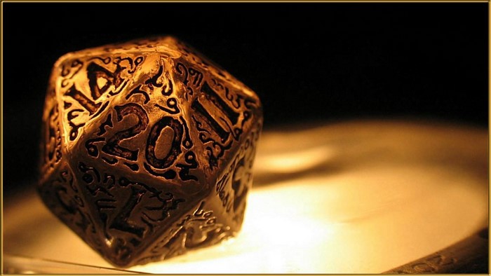 Close-up of an ornate, golden 20-sided die