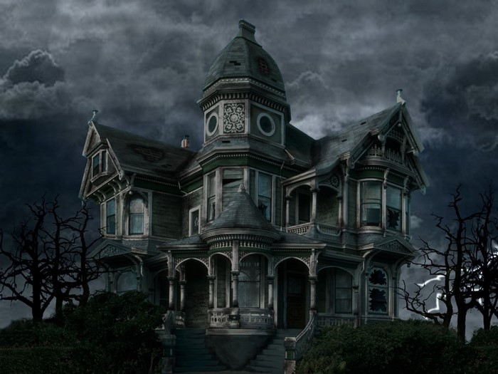 Creepy Victorian mansion at night