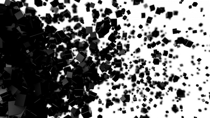 Abstract pattern of black cubes exploding