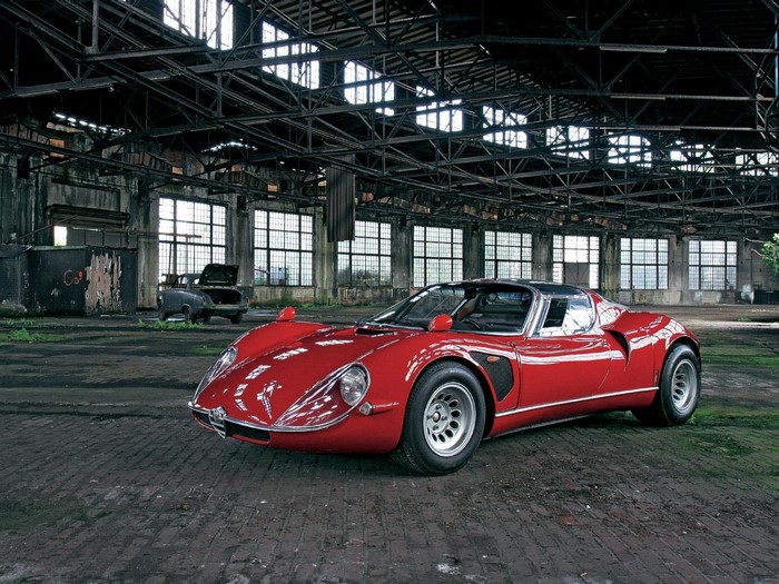 Red Alfa Romeo 33 Stradale in an abandoned warehouse