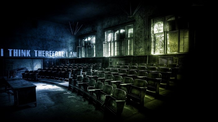 Abandoned classroom with quote "I THINK THEREFORE I AM"